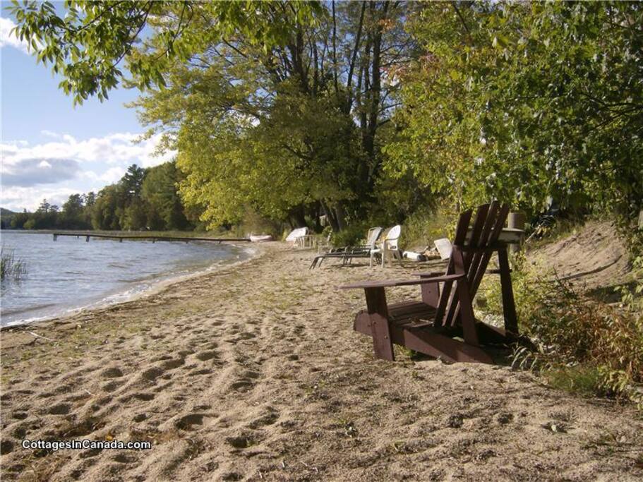 240 feet of sandy beach with 6 large muskoka chairs