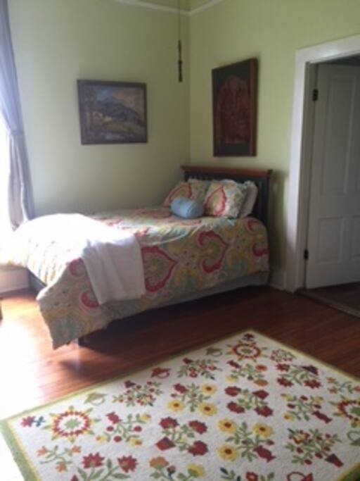 Natalie's room is adjacent to a very short hallway with the bathroom that is shared with the Oat Willie Room.