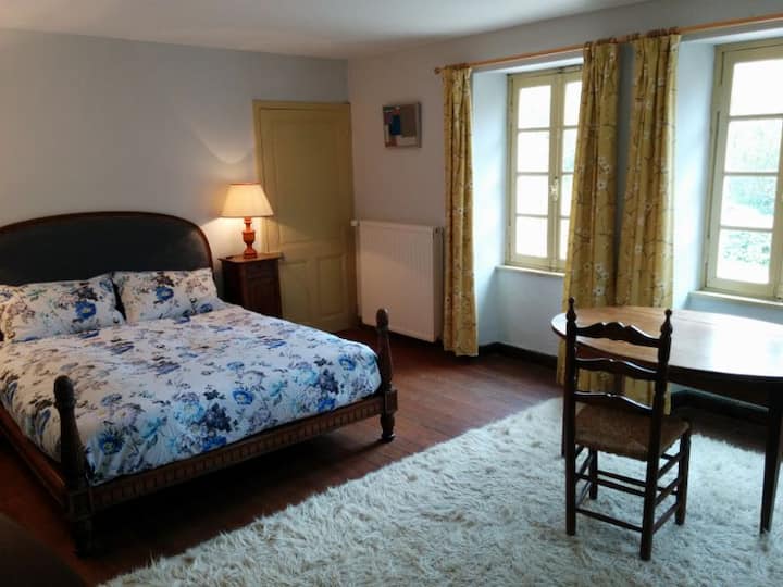 upstairs double room with kingsized antique carved bed and views over front courtyard