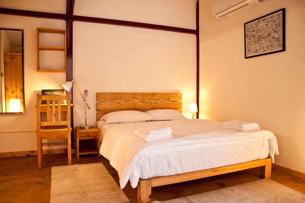 Zen bedroom with queen size bed.