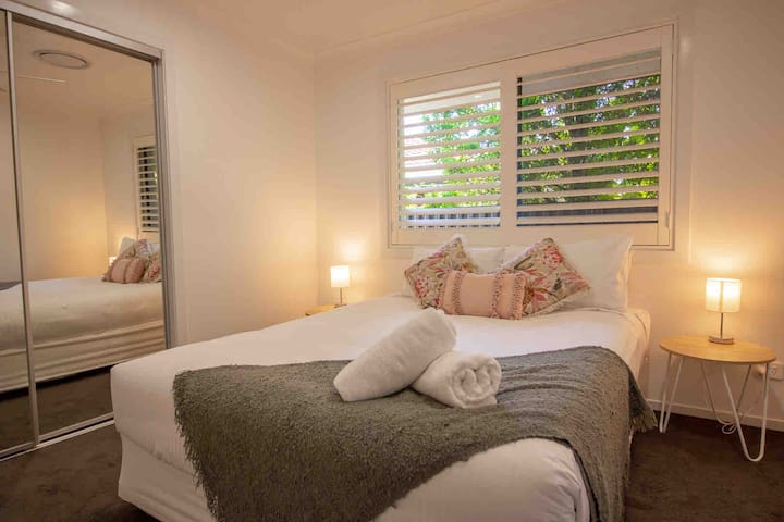 Bedroom 2, with built-ins, blinds and aircon. 
Queen bed.