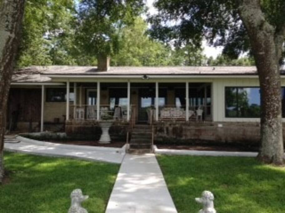 Relax on the large back porch, with fountain, fan, and propane grill.