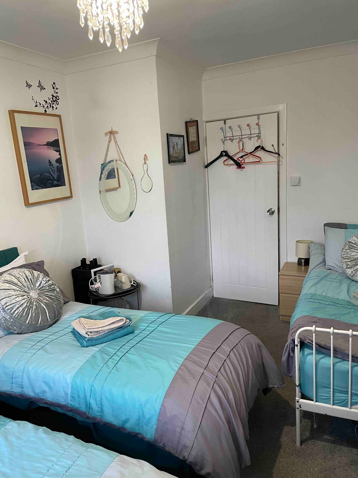 Family room. 3 x single beds or converted to king size on two nights or more. Travel cot with bedding, toys, changing mat. Also available. 