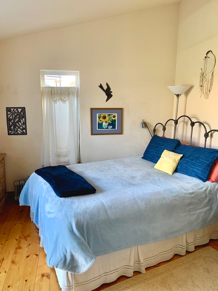 One of the two en-suite bedrooms, as it is 'dressed' in cool summer blues