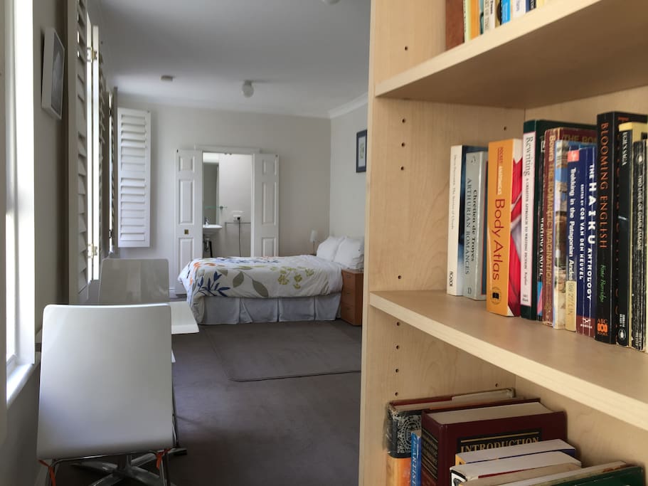 The apartment has its own library of over 150 books