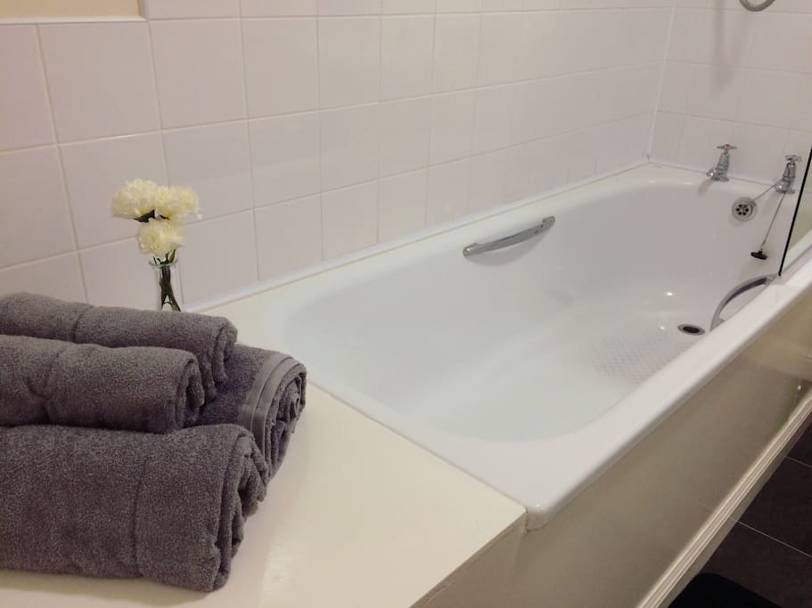 Large bath to soak in after a busy day.