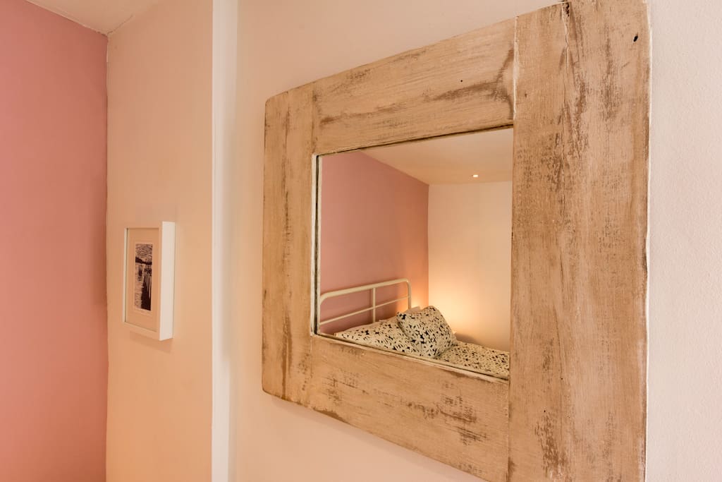 Mirror in double bedroom at the back of the cottage