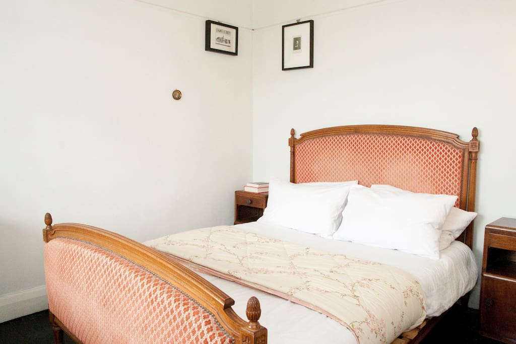 Quiet guest room. Comfortable double bed. Great views over rooftops and City of London.