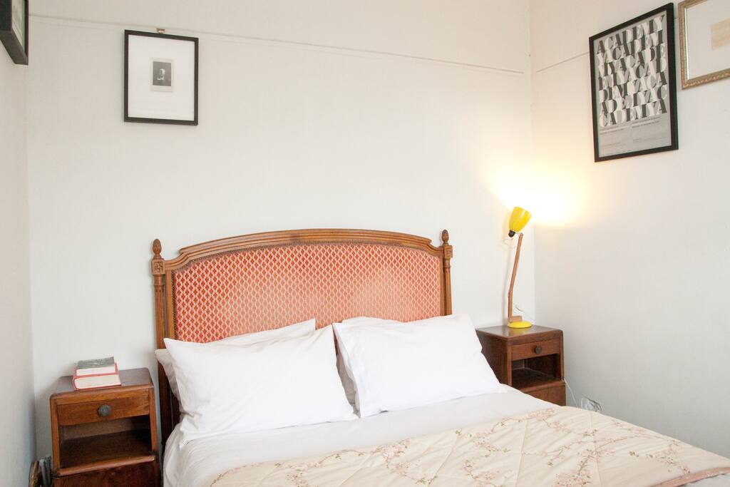 Always clean and fresh bedding and towels. Two bedside tables, hardwood floors and art on walls.