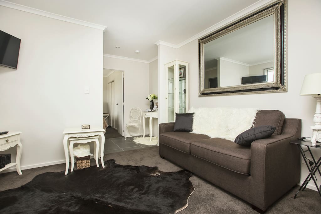 Lounge with separate bedroom in rear view.