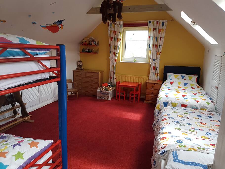 This shows the room made up with an extra bed.