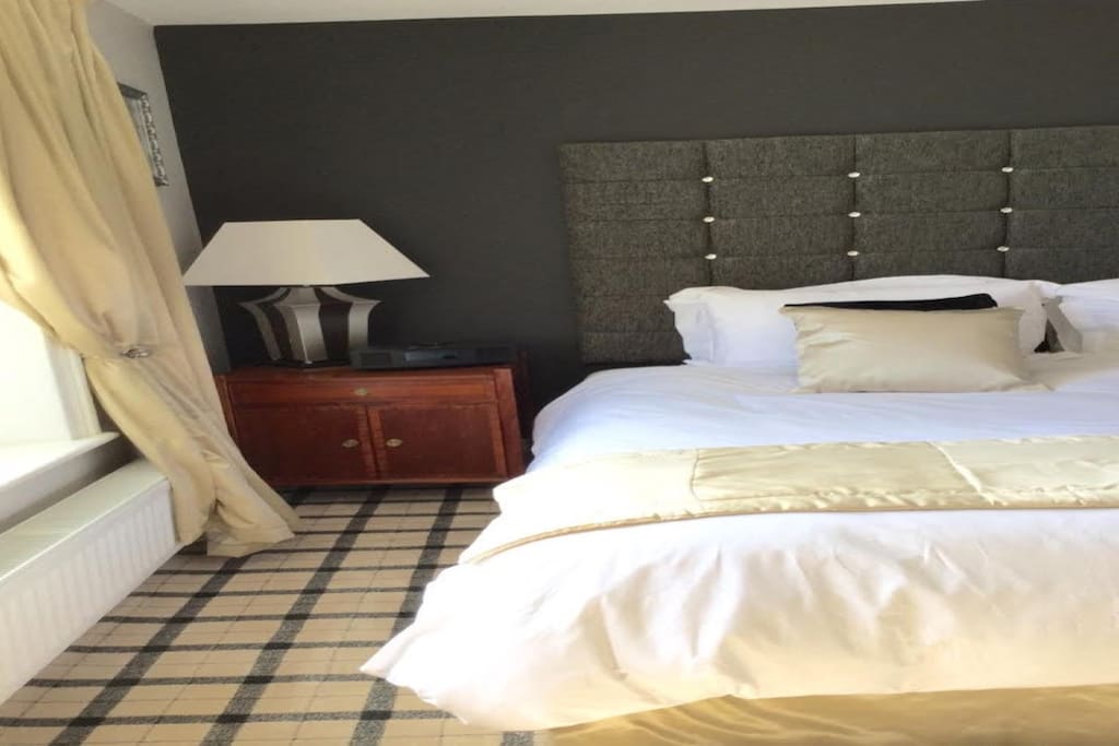 Ratcliffe Room overlooking the South river Tyne with supper king bed.