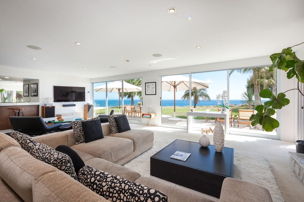 A 7-person sectional in living room looks out to the panoramic ocean views.