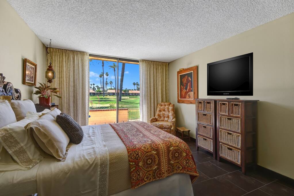 Master suite with course views and patio access