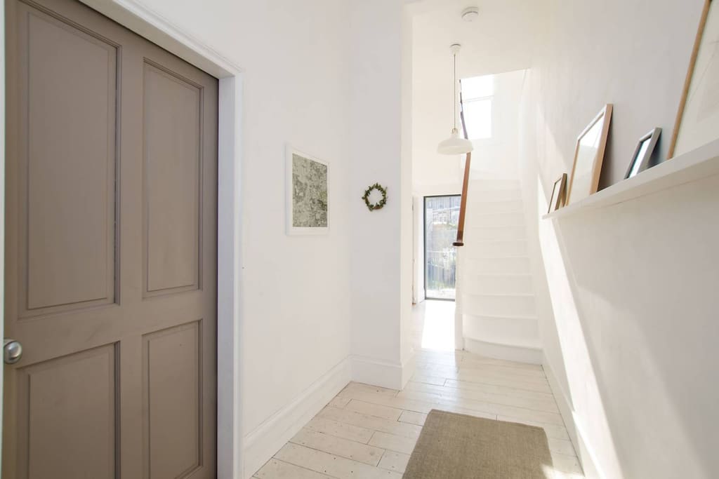 Hallway with floor to ceiling window onto the garden (ground level)