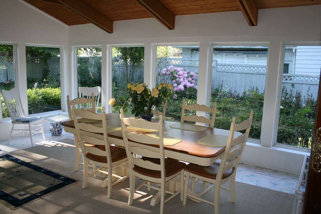 The sunroom has a cathedral ceiling, and custom-made dining table and chairs where most of our guests enjoyed their meals, board games and good conversations.