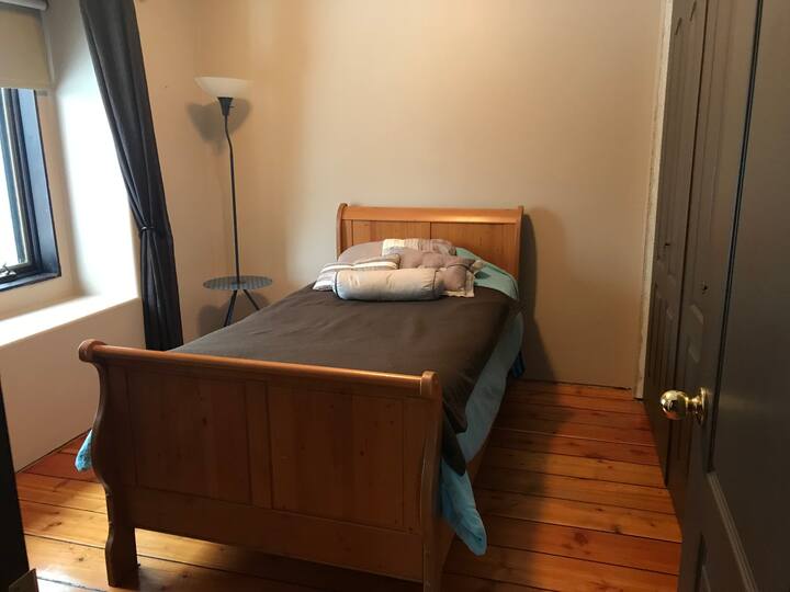 Upstairs Bedroom: located near the upstairs bathroom, large bay window and large closet. Desk located in the left corner 