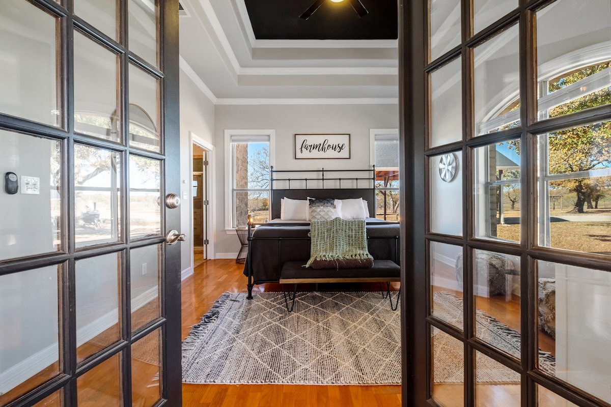 Master suite with french doors leading to wrap around porch