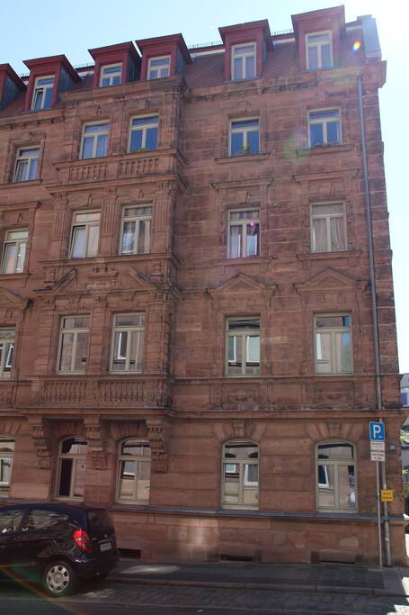 Outside view of the 1899 building with parking all around.