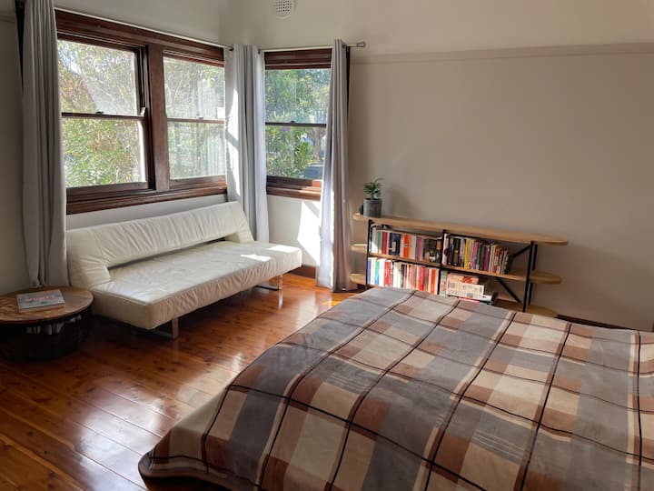 Spacious bedroom with loads of natural light and a Queen size bed with bamboo mattress. 
