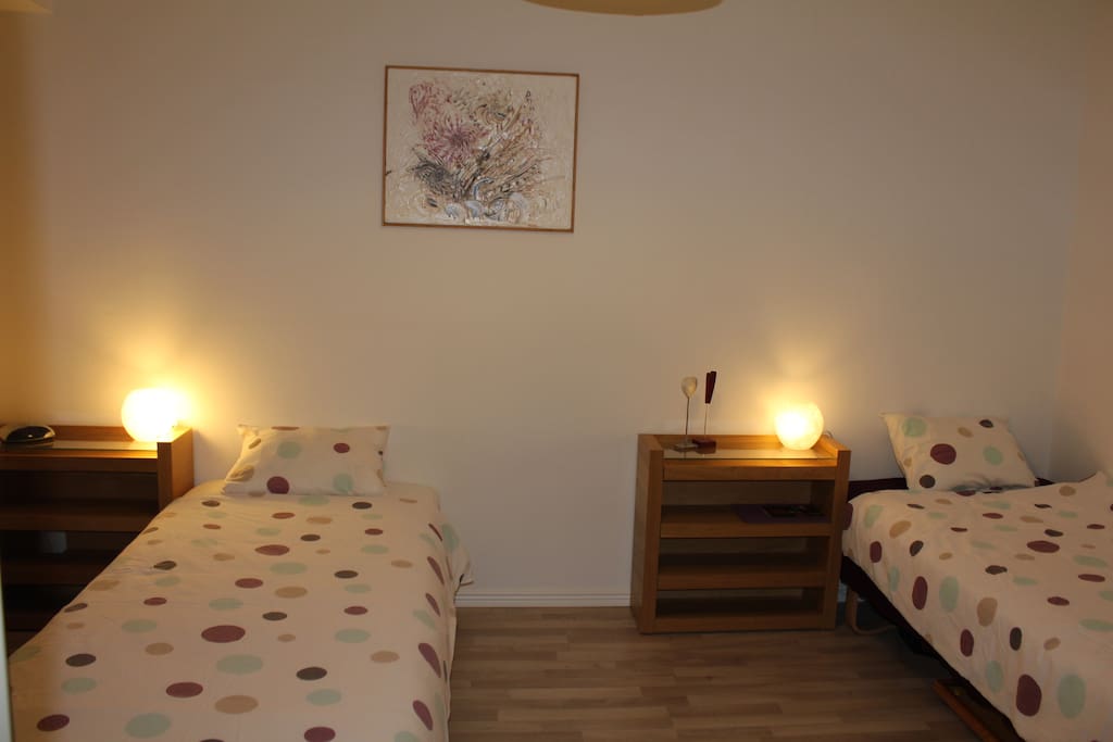 The bedroom with two simple beds