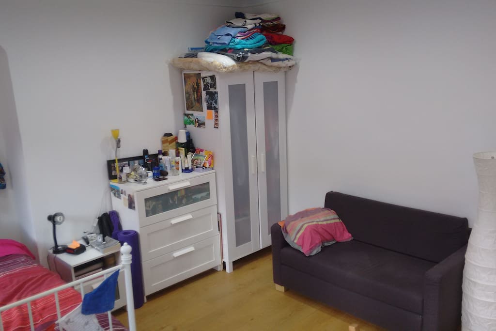 Large room size is apparent, plus couch! Work table is just to the right of the picture.