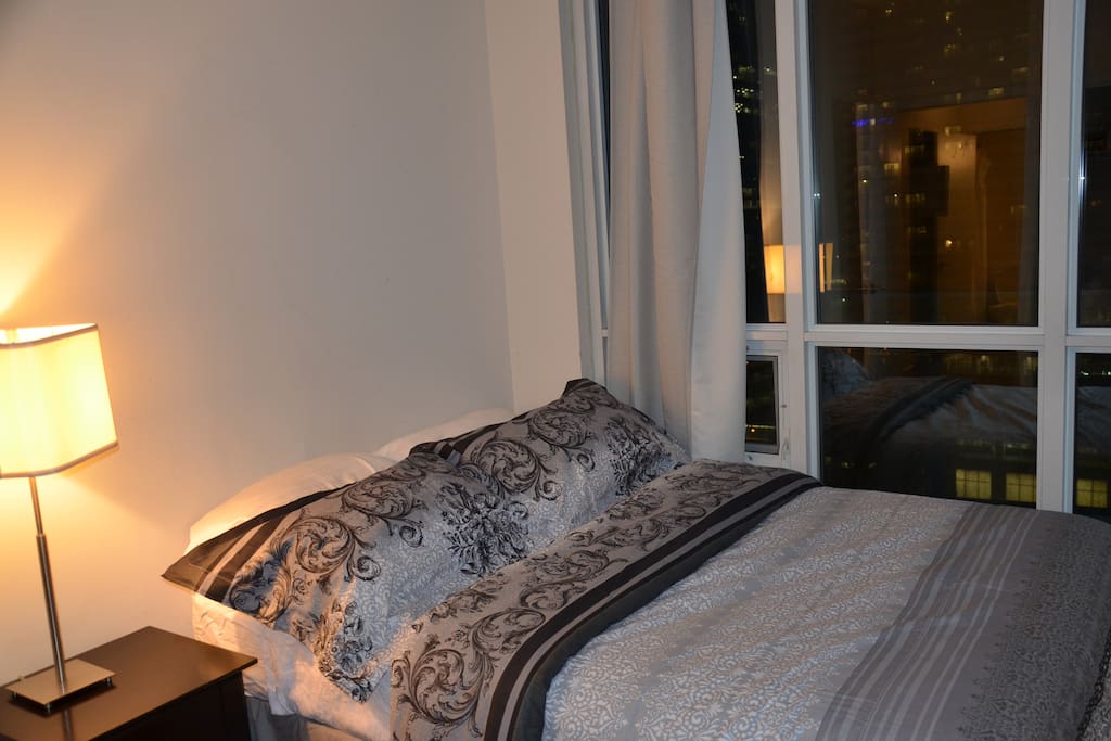 Guest Bedroom with Queen Bed + City View