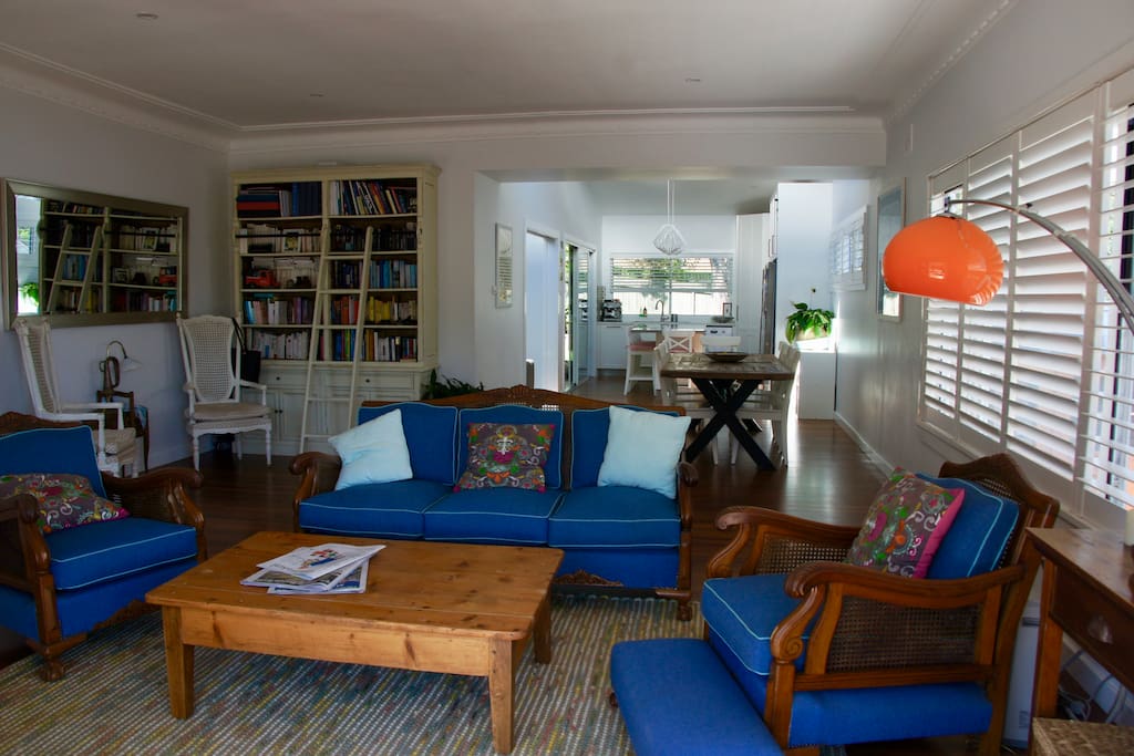 Sun drenched living room overlook front deck and yard.