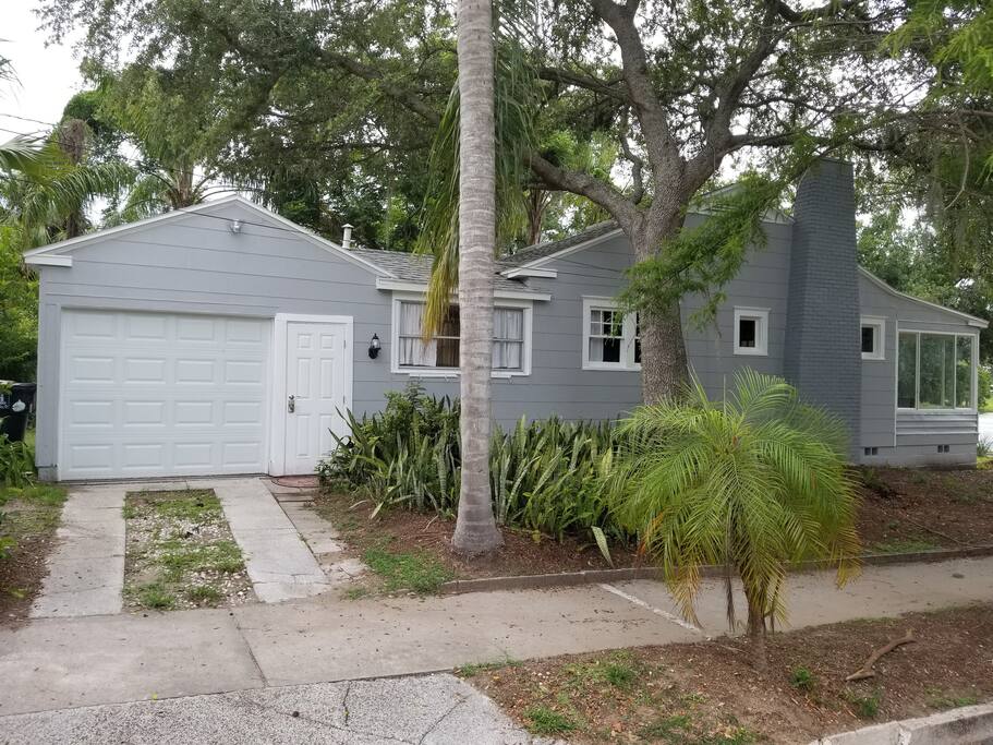Side of house view including automatic garage door & security coded entrance