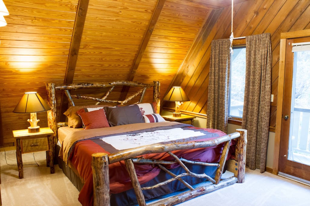 Master bedroom with King size log bed upstairs.