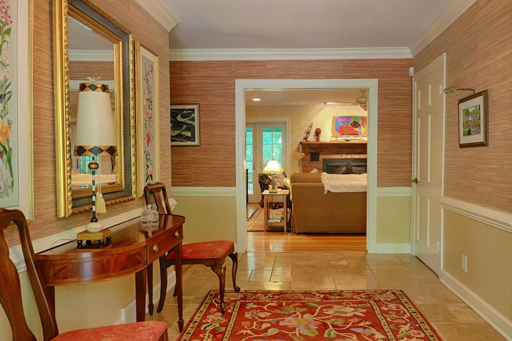 Entry foyer to home and apartment. Apartment door is on the right.
