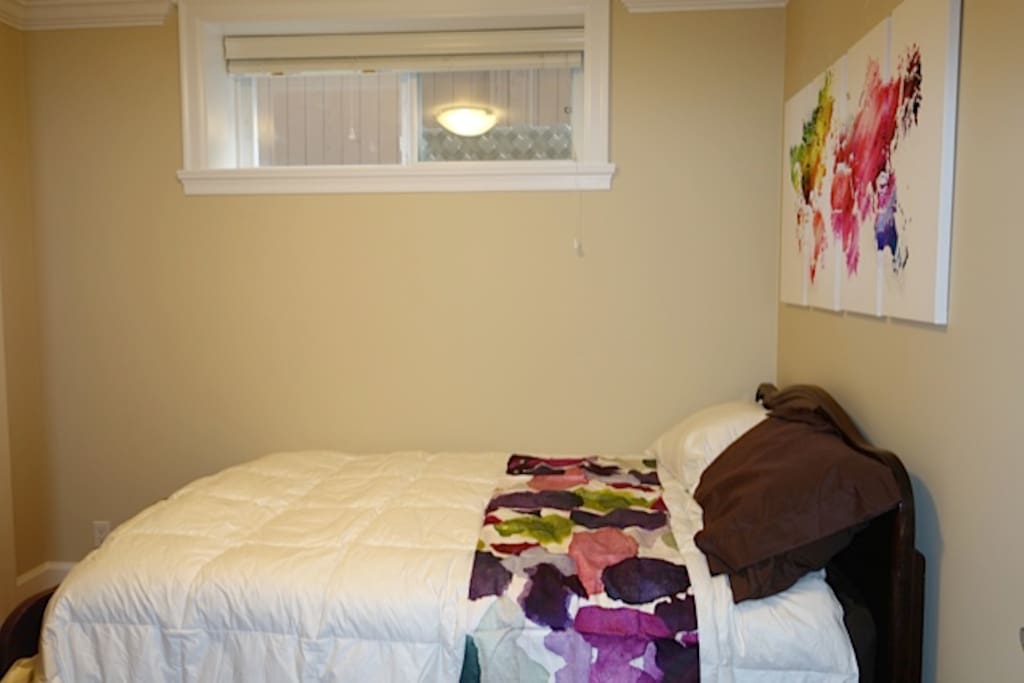 Bedroom 1 with queen bed and desk.