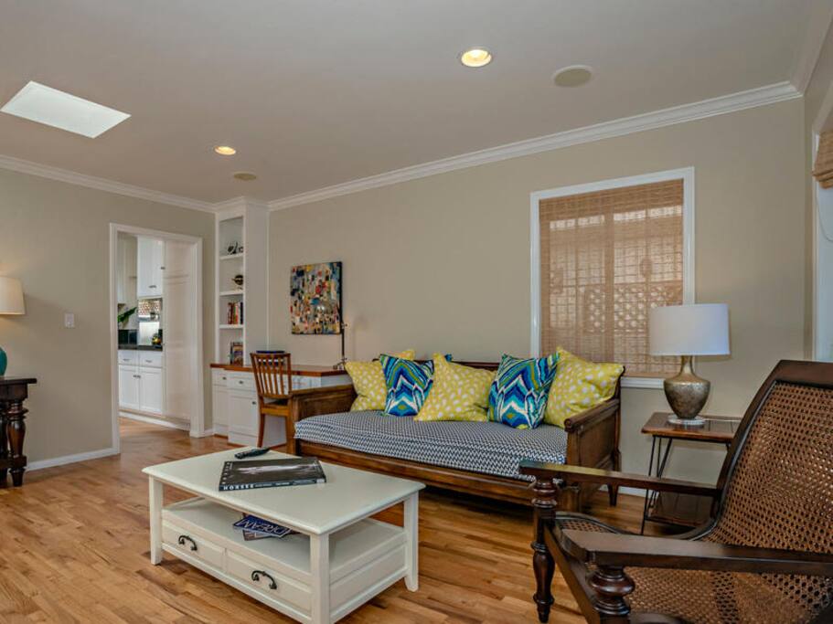Front room has a built in desk, comfortable seating and large TV
