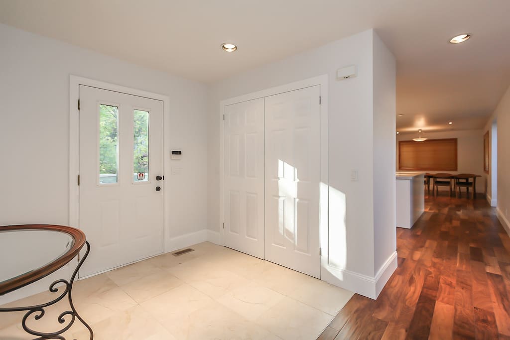 The inviting foyer has brand new marble flooring with plenty of closet space.