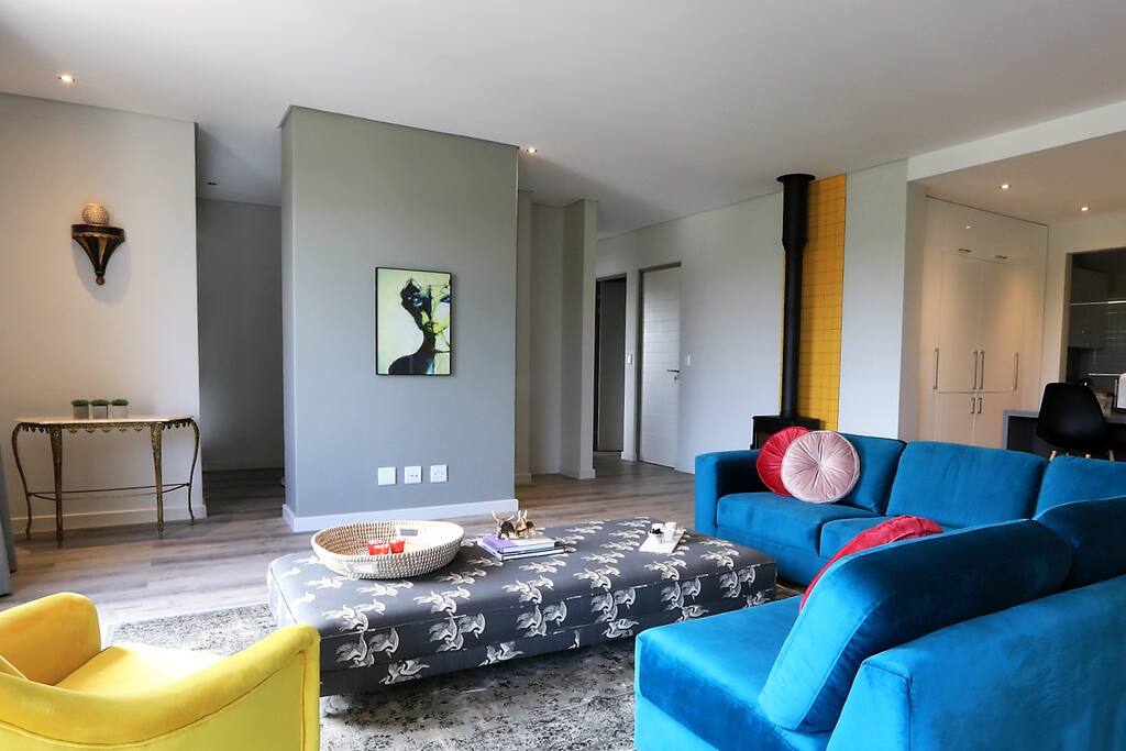 Brand new furniture. Soft velvet, extra length couch with wood burning Dovre fire place.