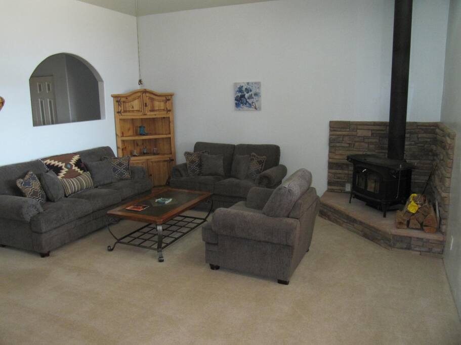 The expansive living room is perfect for winding down after a long day of exploring