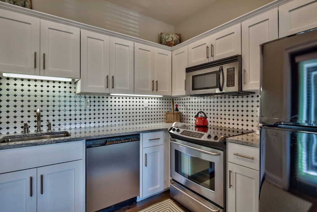 You'll find stainless steel appliances contrast perfectly with the creative backsplash.