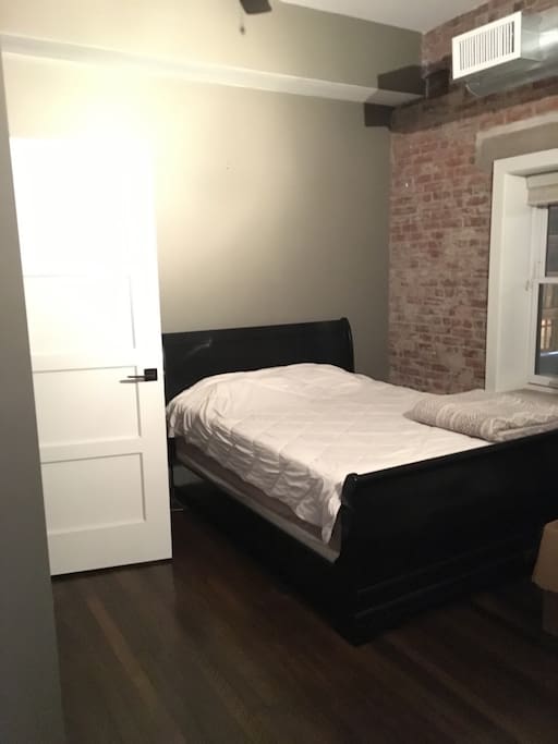 Bedroom, contemporary exposed brick, authentic wood floors