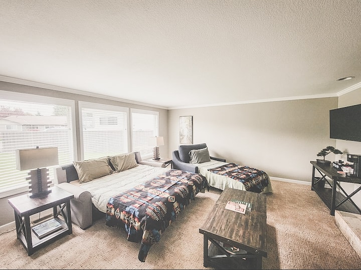 Memory foam queen and twin pull out beds with TV and slider doors for privacy room and it's own coffee bar.