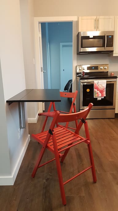 Small kitchen table that folds down to save space.