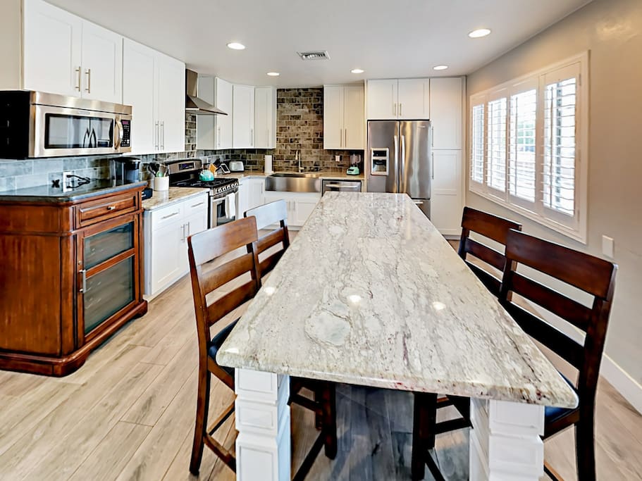 Light, bright and fully stocked - this designer kitchen will delight the chef in your group.