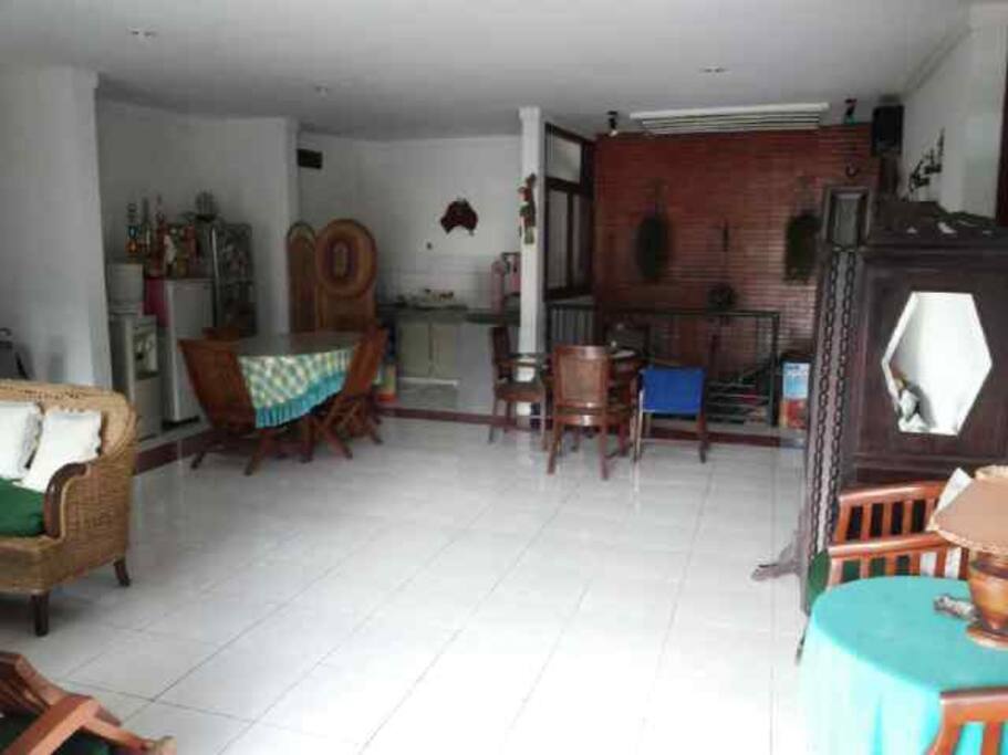 The living room, the dining room, and the kitchen.