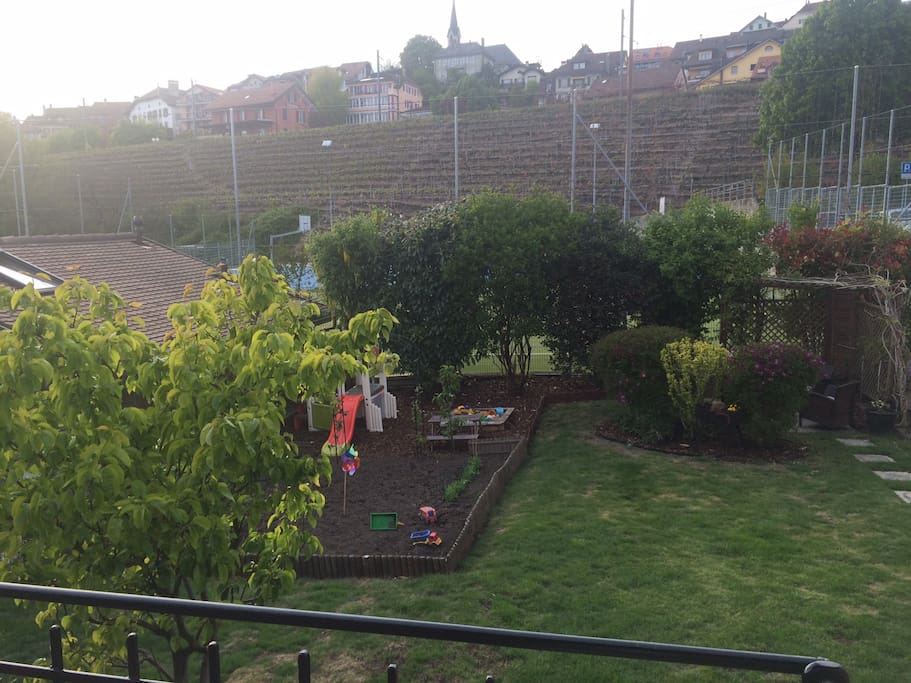 Our fenced in garden with toys for children, BBQ and outdoor seating