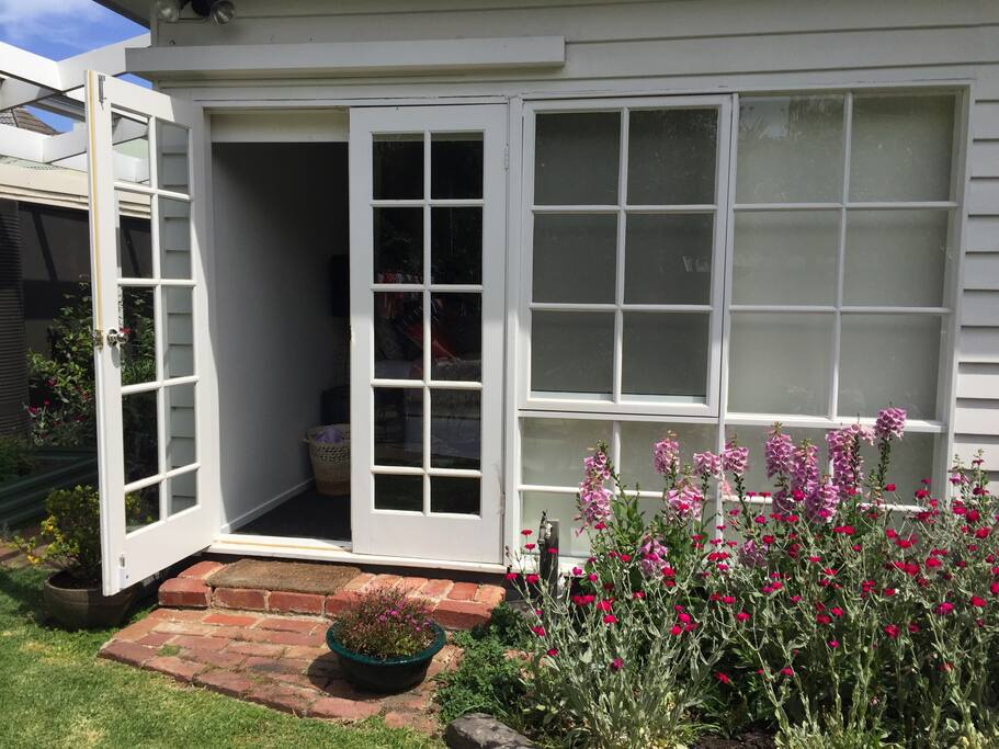 Master bedroom opens onto back garden