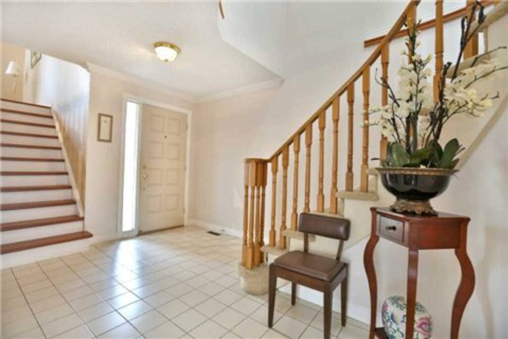 Front foyer, stairs on left to family room, stairs on right to bedrooms