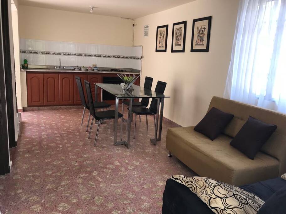 Dinning room with kitchen equipped with basic crockery to cook