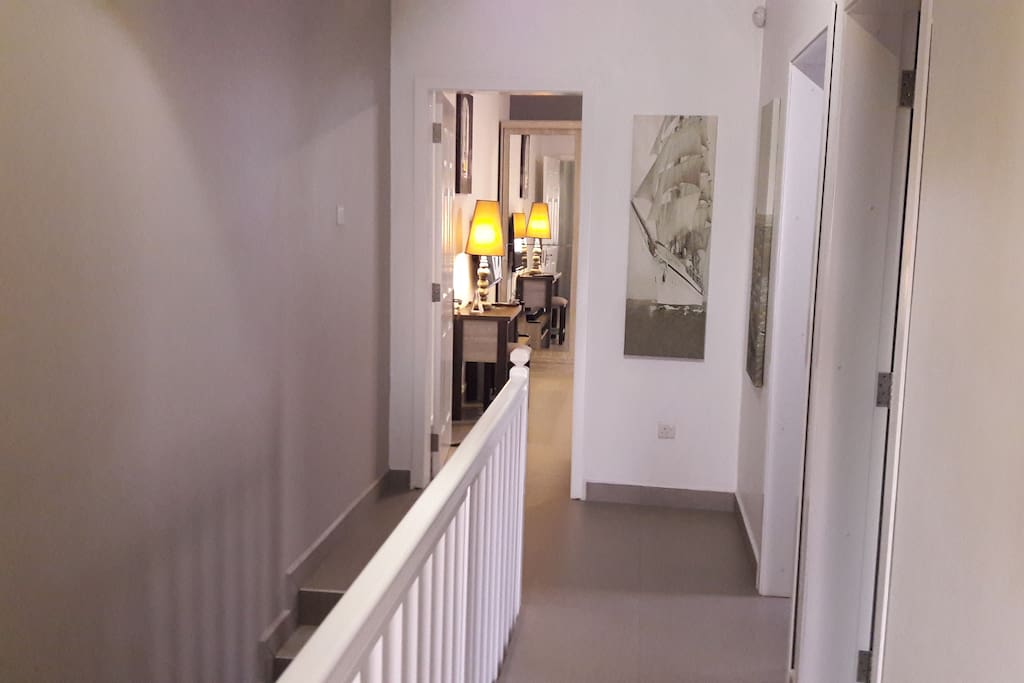Staircase to Guest Bedroom. Private bathroom on the right