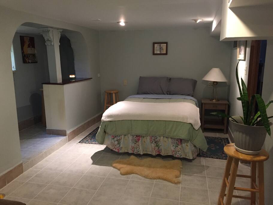 This is a queen size rised bed with two night stands in main room