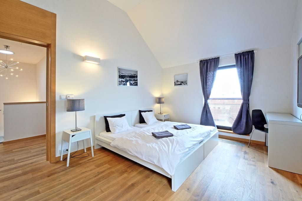 1st bedroom with TV and a terracce