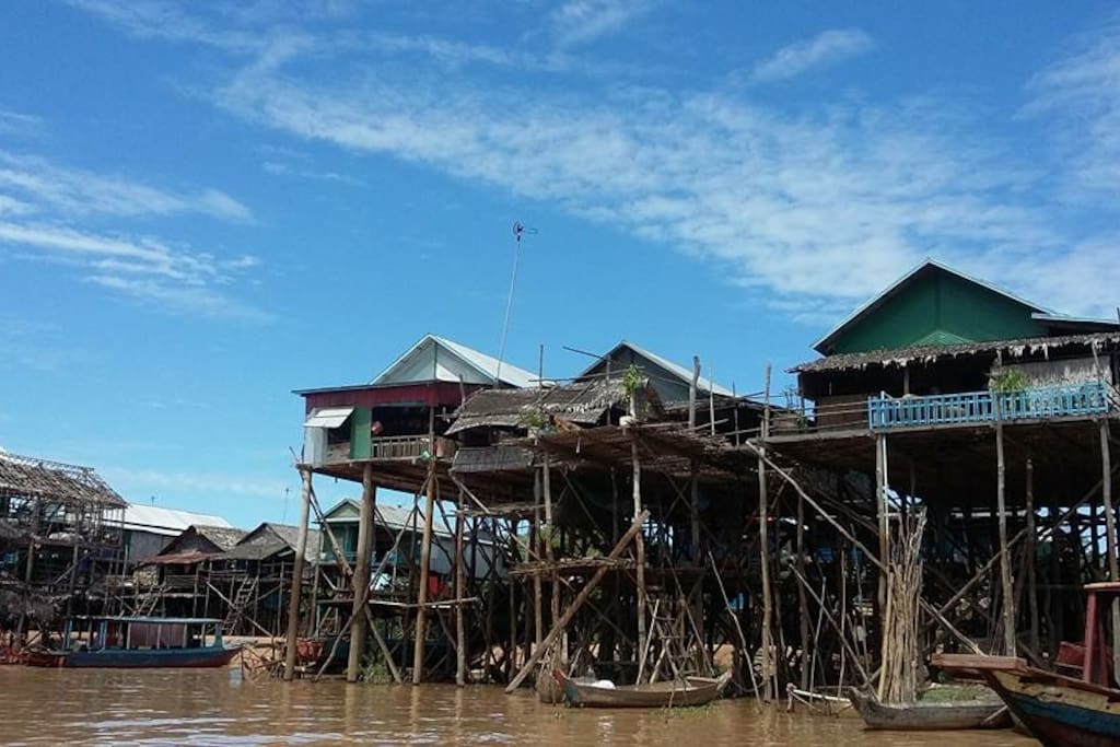 Kampong Pluk is about 20 Km locates on the Southeast of Siem Reap Town.
Over 3000 inhabitants are real Khmers, their households made of wood and bamboo built on stilts of about 6m to 7m high. During dry season when the lake is low and lack of water those buildings look like the skyscrapers. At this time of the year many of villagers move out onto the lake and build a provisional stilted houses. In wet season while the water level rises up again, the dwellers move back to their permanent houses on the flood plain, the stilts now hidden under the water. People made a living by catching fishes produce as well as smelly fish paste, fermented fish, smoked fish, dried fish, dried prawn etc.